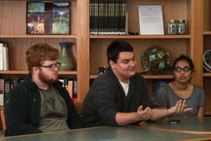 Michael Suchecki being the student discussion leader at the round table discussion in the high school library. (AMELIA ONISHI)